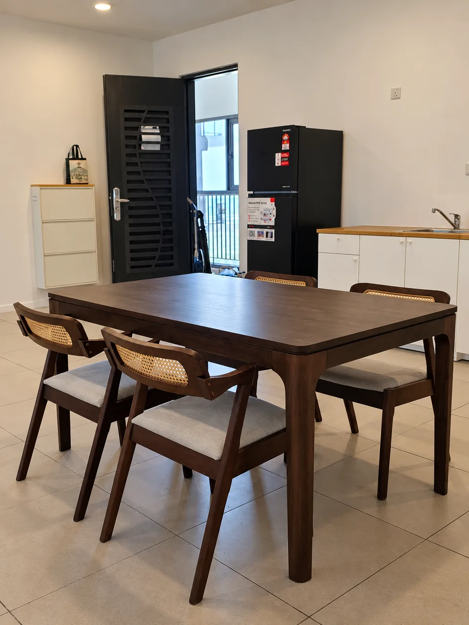 Anggun Residence, Batu Kawan: Dining area beside the kitchen counter and refrigerator.