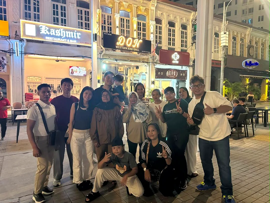 Adults and families from the wider local team at a Penang gathering