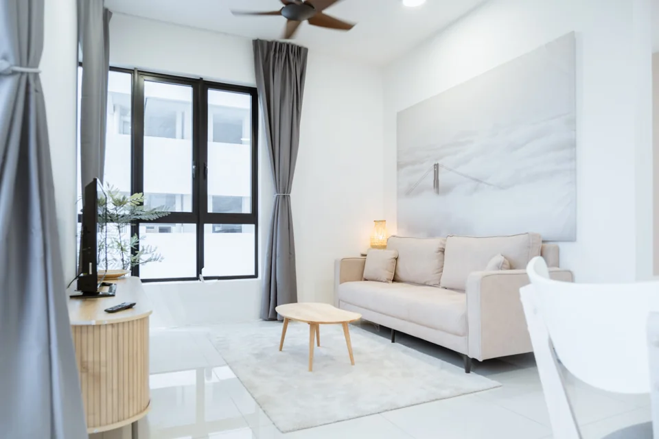 Vivo Batu Kawan: Living area with sofa, coffee table, TV console and curtains.