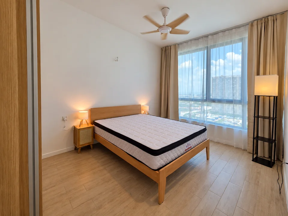 Anggun Residence, Batu Kawan: Master bedroom with wooden bedframe, bedside lighting and curtains.